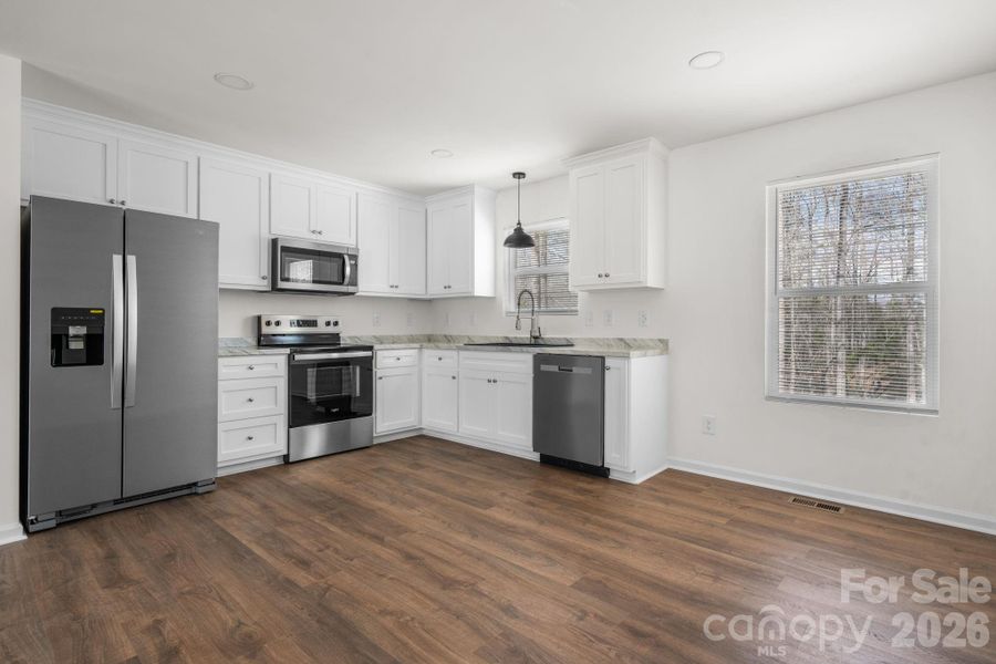 Furnished interior view inside a new home in , Valdese (Image 6).