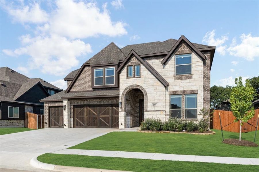Front exterior of a new home in Sunrise at Garden Valley 60-79, Waxahachie, TX, highlighting curb appeal (Image 2). Front exterior of a new home in Sunrise at Garden Valley 60-79, Waxahachie, TX, highlighting curb appeal (Image 2).