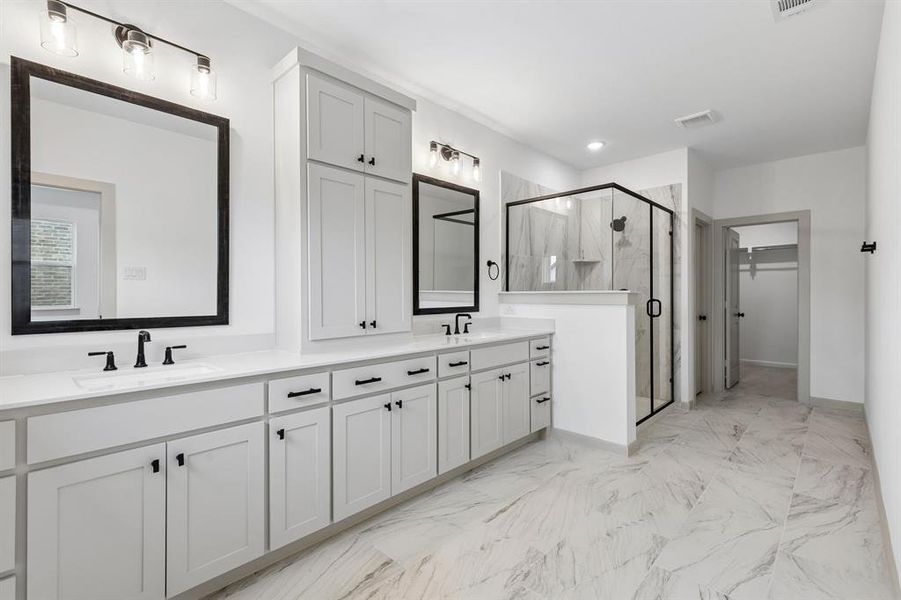 Filled with style, sophistication and space, this fantastic Owner's bath was built for two!