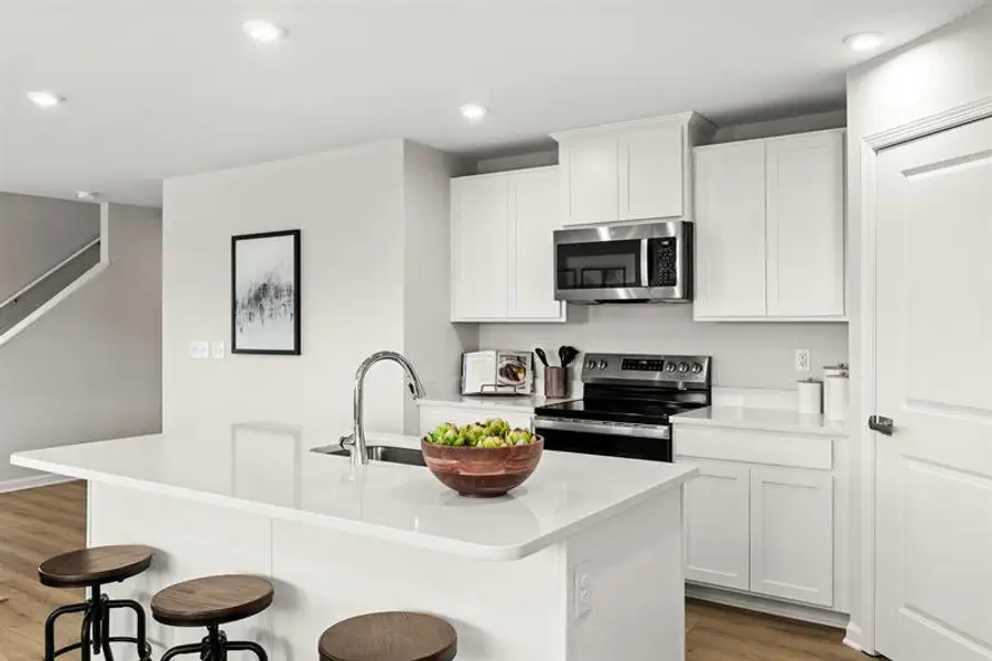 Representative furnished interior of a home built from the Woodford by Ryan Homes in Oakwood Trace, Fairburn (Image 2).