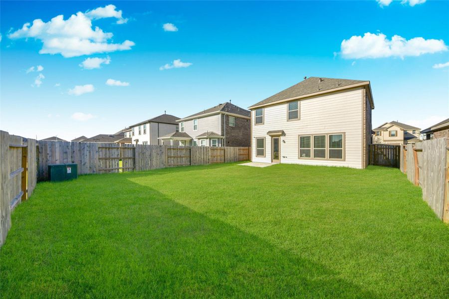 Exterior details and patio area of a home in Sunterra North, Katy (Image 3).