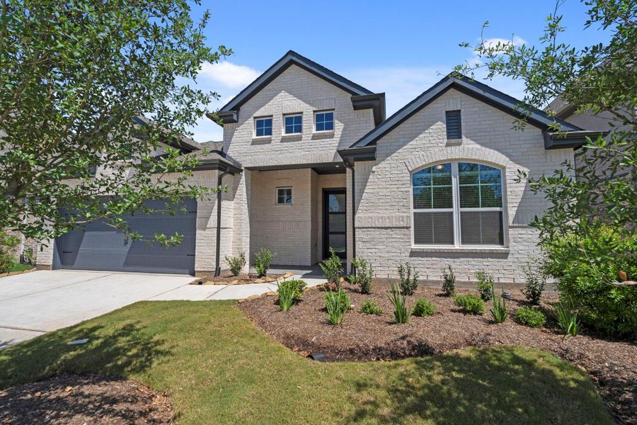Front exterior of a new home in Jordan Ranch, Fulshear, TX, highlighting curb appeal (Image 21).