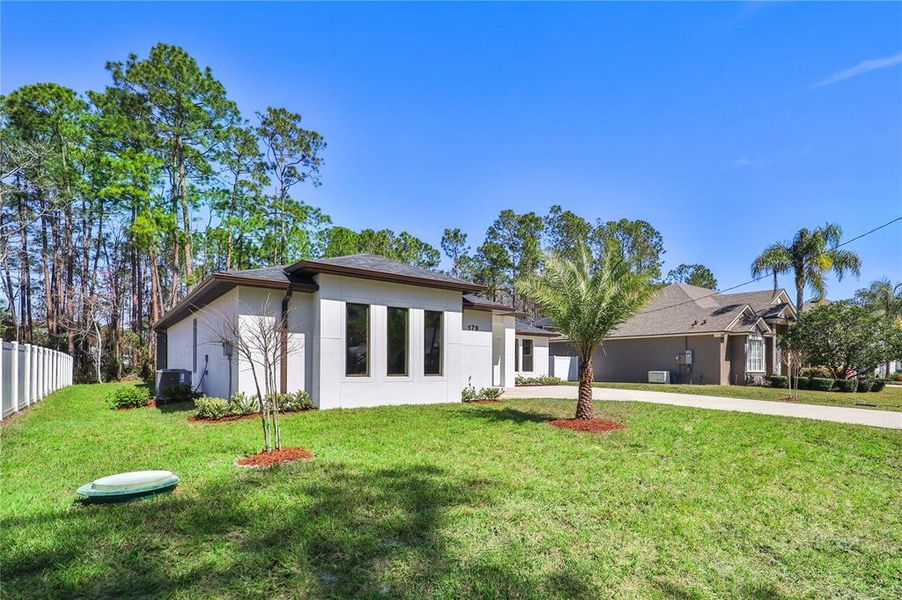 Front exterior of a new home in , Palm Coast, FL, highlighting curb appeal (Image 29). Front exterior of a new home in , Palm Coast, FL, highlighting curb appeal (Image 29).