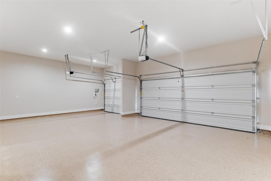Garage featuring baseboards