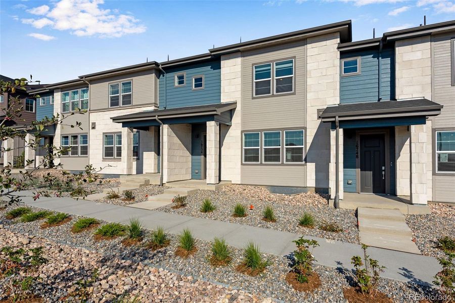 Front exterior of a new home in , Arvada, CO, highlighting curb appeal (Image 19).