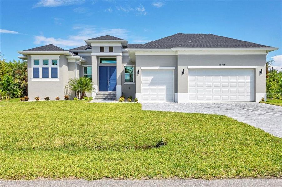 Front exterior of a new home in , Port Charlotte, FL, highlighting curb appeal (Image 17).