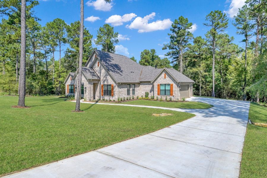 Front exterior of a new home in The Cedars, Plantersville, TX, highlighting curb appeal (Image 25).