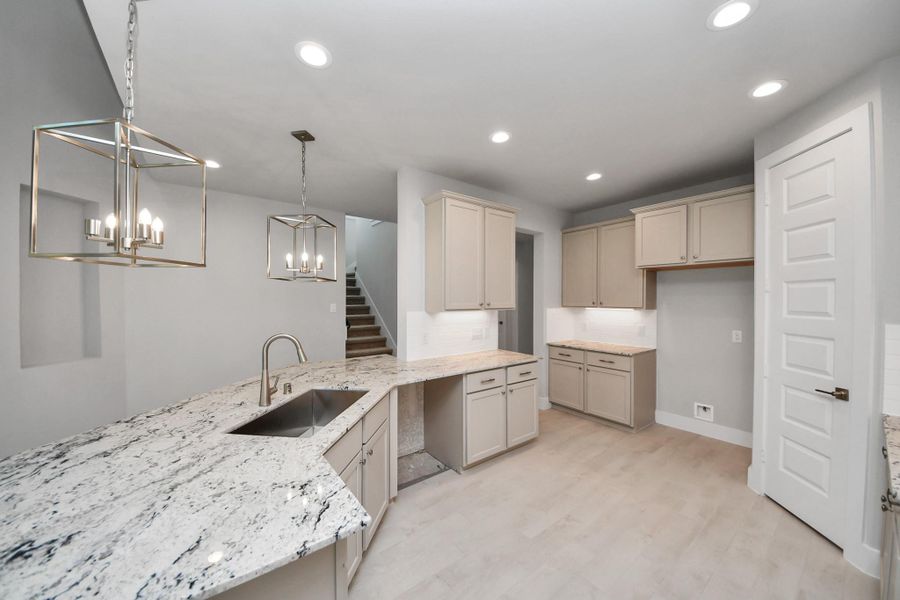 The extended counter area adds both practicality and style, making meal preparation a breeze. Every detail is thoughtfully designed to enhance the kitchen's functionality and aesthetic appeal. The extended counter area adds both practicality and style, making meal preparation a breeze. Every detail is thoughtfully designed to enhance the kitchen's functionality and aesthetic appeal.