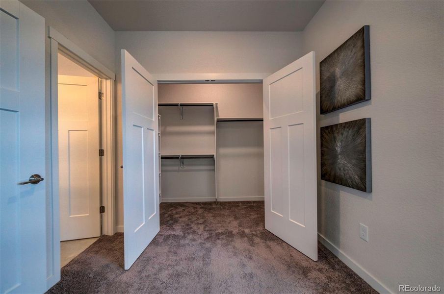 Primary bedroom has two closets. This is closet one.