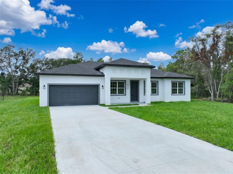 Front exterior of a new home in , Ocala, FL, highlighting curb appeal (Image 19). Front exterior of a new home in , Ocala, FL, highlighting curb appeal (Image 19).