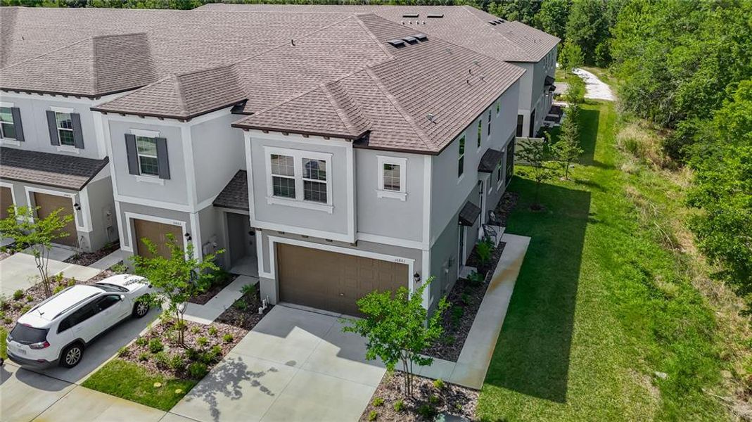 Front exterior of a new home in , Tampa, FL, highlighting curb appeal (Image 27).