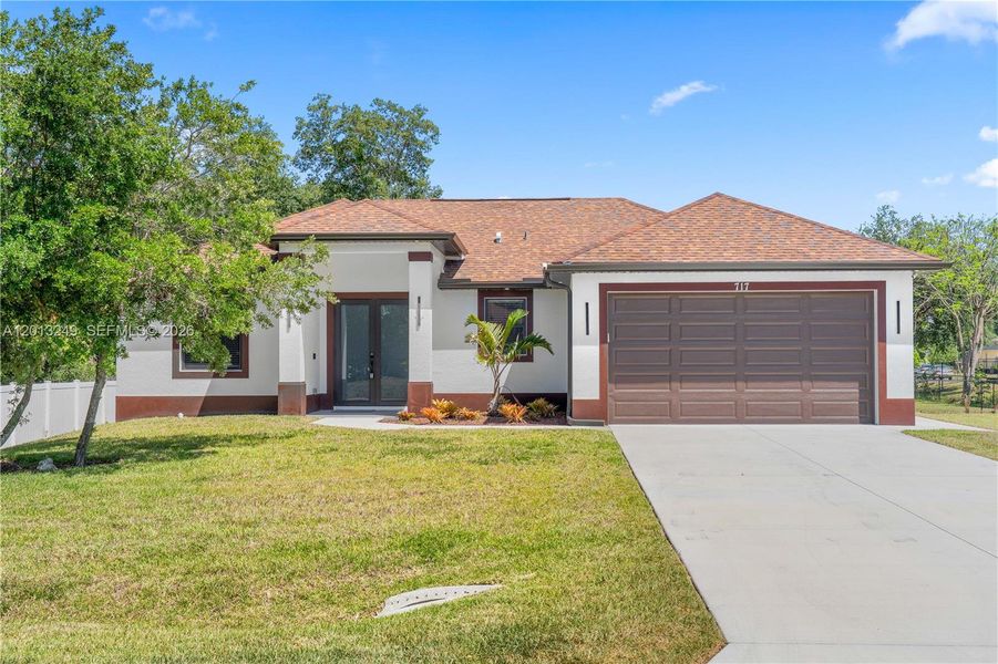 Front exterior of a new home in , Fort Myers, FL, highlighting curb appeal (Image 22).