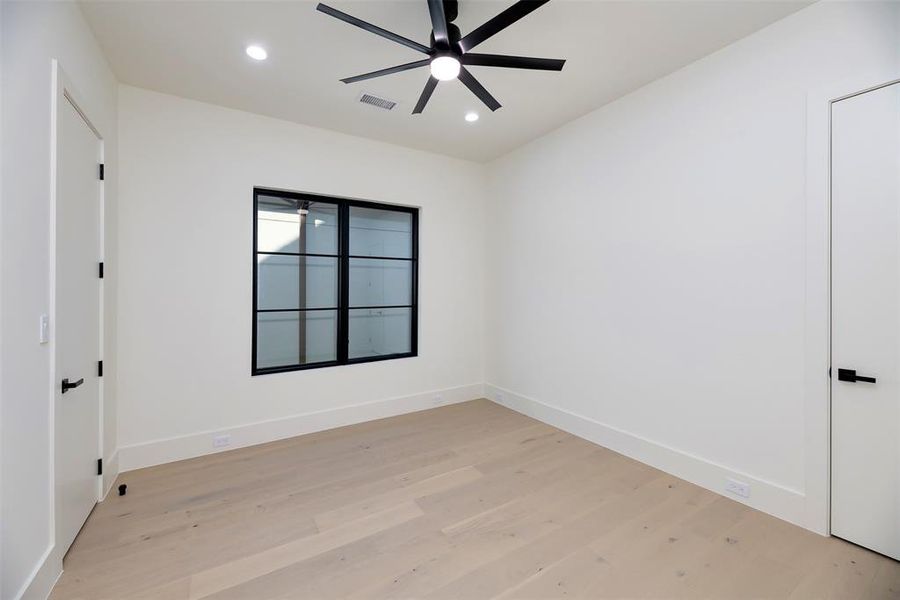 Bedroom with light wood-style flooring, recessed lighting, and ceiling fan