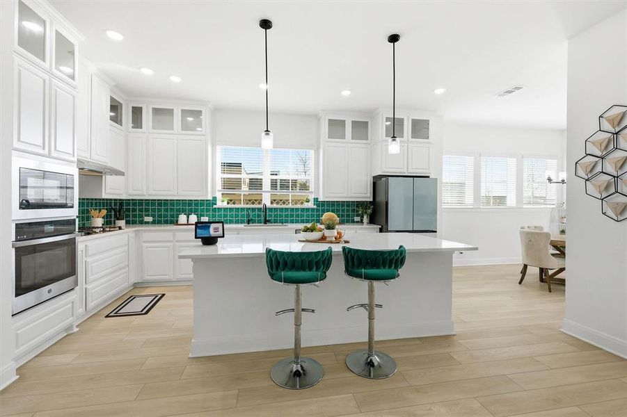 Premium kitchen with 42" uppers and top tier display cabinetry. Premium kitchen with 42" uppers and top tier display cabinetry.