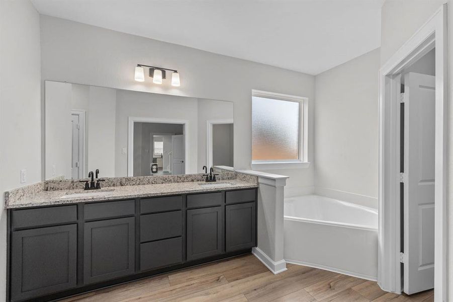 The primary bath features large walk-in shower, corner garden tub, and spacious vanity.