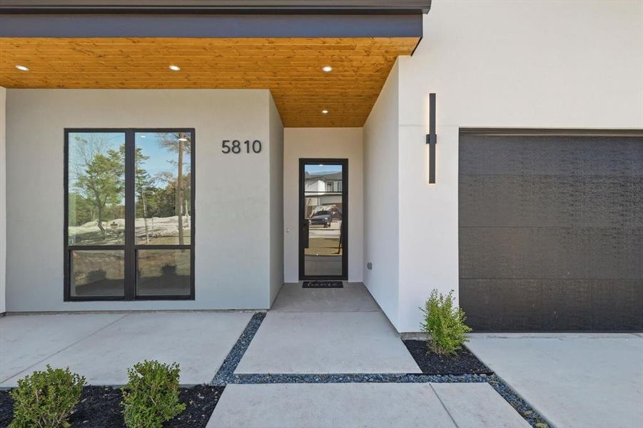 Property entrance with stucco siding Property entrance with stucco siding
