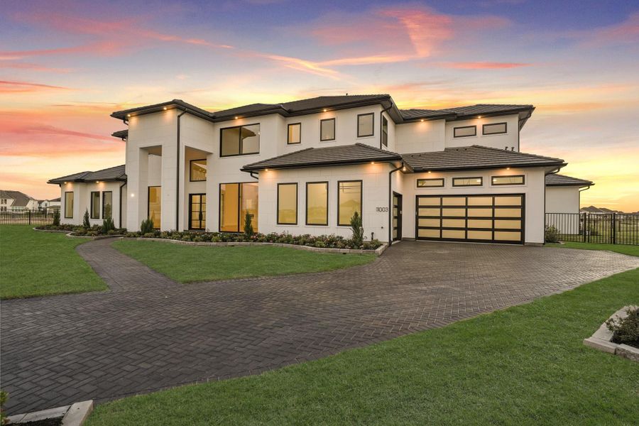 Beautiful home featuring an expansive driveway and well-maintained lawn, offering ample space for parking and outdoor enjoyment Beautiful home featuring an expansive driveway and well-maintained lawn, offering ample space for parking and outdoor enjoyment