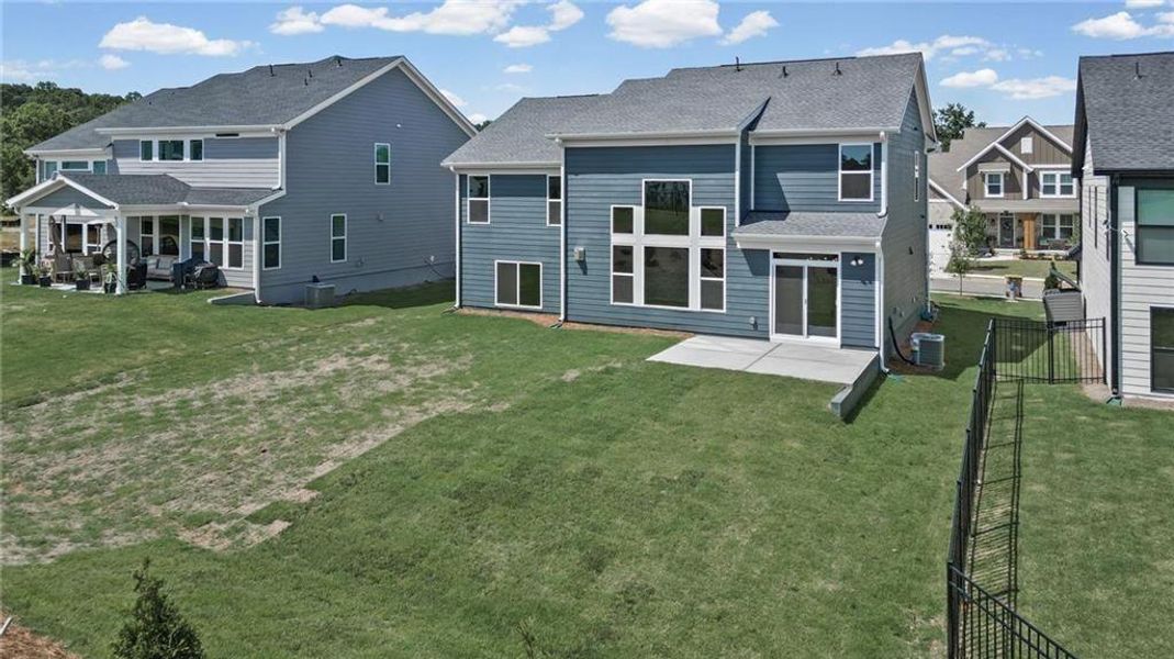 Exterior details and patio area of a home in Twin Lakes, Hoschton (Image 26).