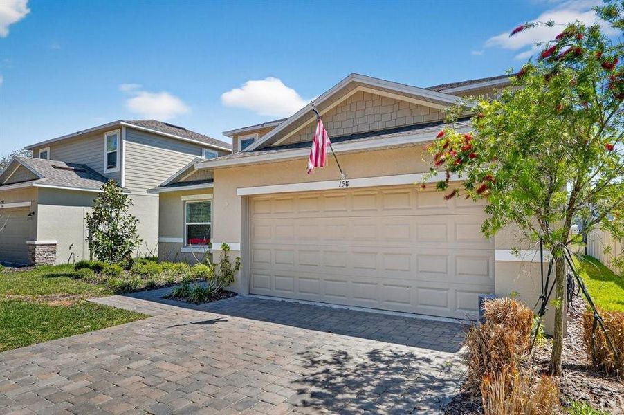 Front exterior of a new home in Riverfront, Edgewater, FL, highlighting curb appeal (Image 24).