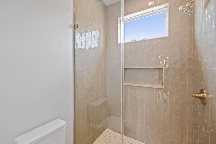 Full bath with a stall shower and toilet Full bath with a stall shower and toilet