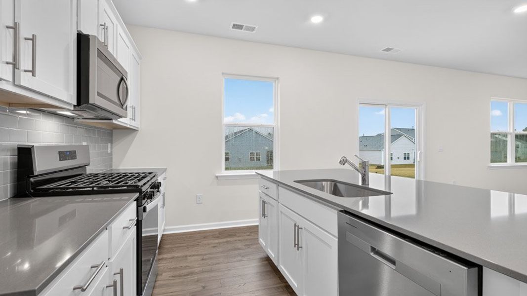 Representative furnished interior of a home built from the BELHAVEN by D.R. Horton in Cross Creek, Spring Lake (Image 4).