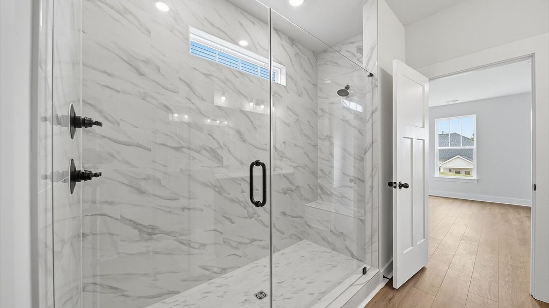 Notable primary bath featuring a spacious walk-in shower and tasteful design touches throughout located in Moore, SC