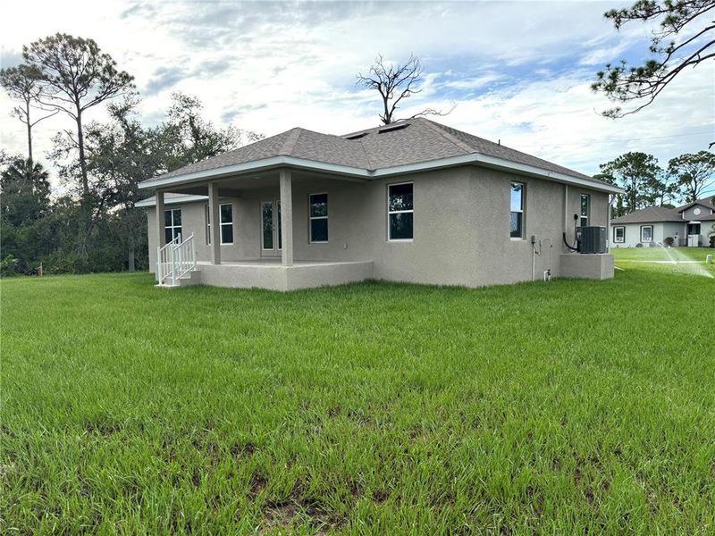 Front exterior of a new home in Rotonda, Rotonda West, FL, highlighting curb appeal (Image 1).