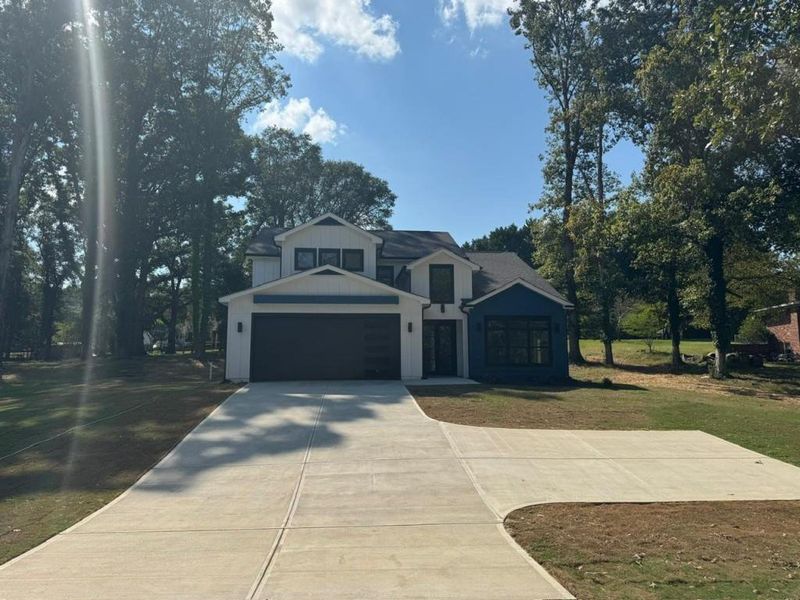 Front exterior of a new home in , Winder, GA, highlighting curb appeal (Image 13).