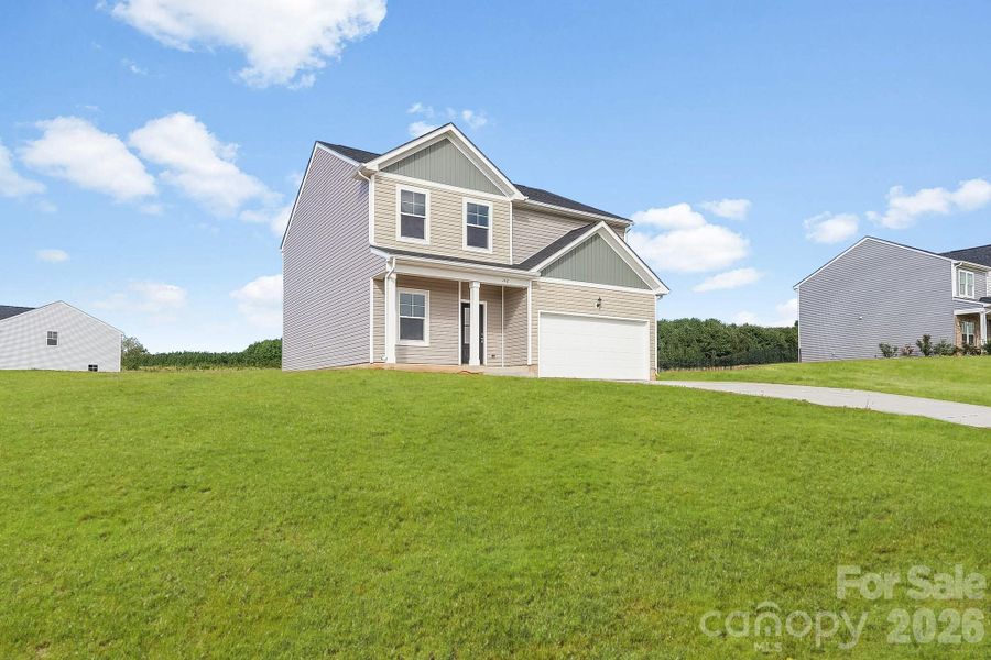 Front exterior of a new home in , Statesville, NC, highlighting curb appeal (Image 2). Front exterior of a new home in , Statesville, NC, highlighting curb appeal (Image 2).
