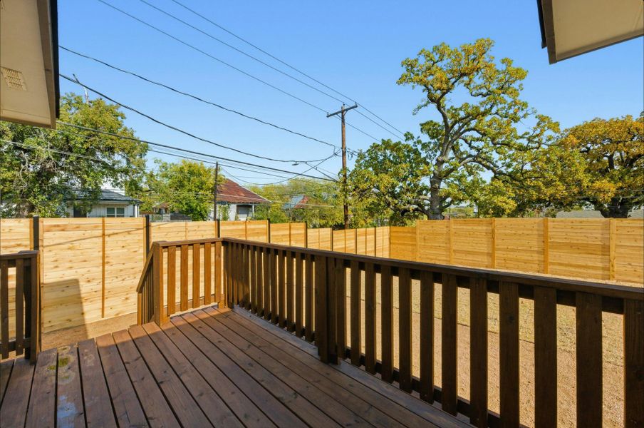 Wooden terrace featuring a fenced backyard