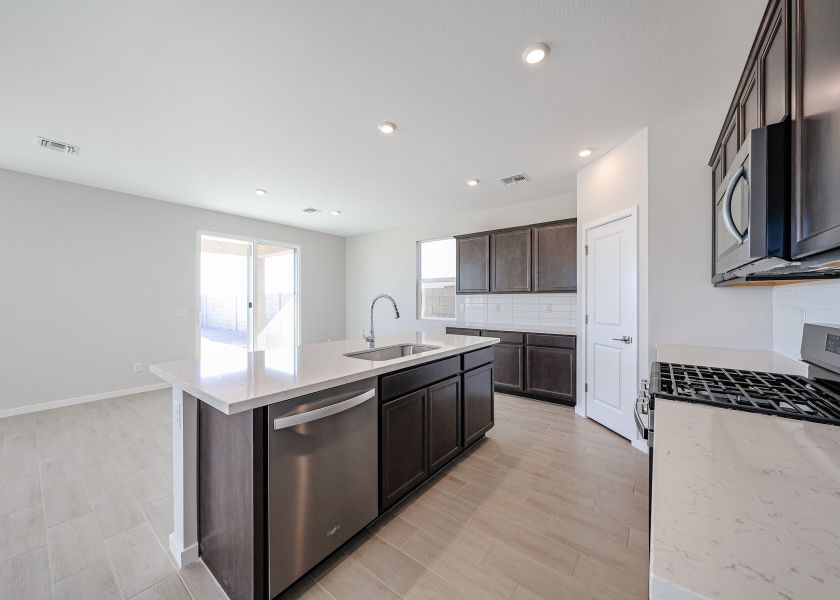 A kitchen with a large island.