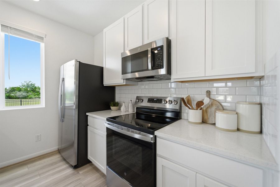 Representative furnished interior of a home built from the Kahn by CastleRock Communities in Municipal Drive Townhomes, Leander (Image 14).