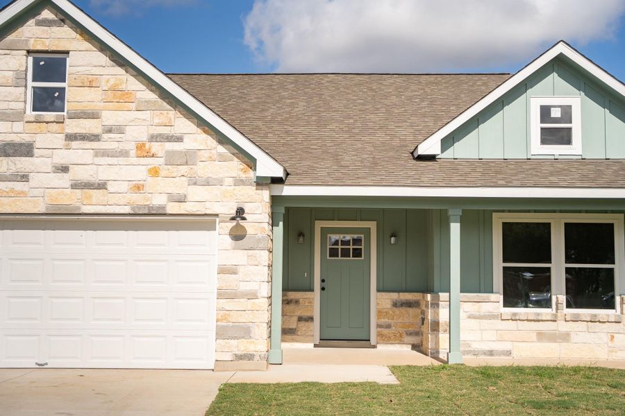 Front exterior of a new home in , Smithville, TX, highlighting curb appeal (Image 2).