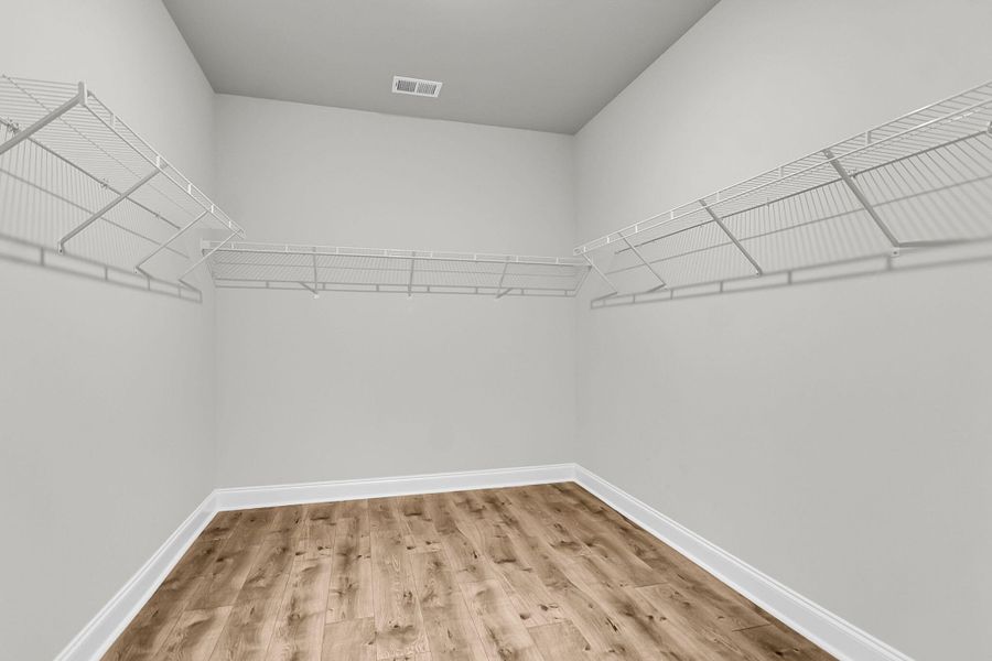Spacious, unfurnished interior of a new home in Tidewater at Lakes of Cane Bay, Summerville (Image 18).