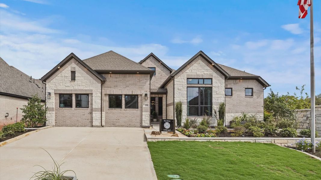 Representative exterior photo of a completed home built from the Drios by Chesmar Homes in 6 Creeks, Kyle, TX (Image 1). Representative exterior photo of a completed home built from the Drios by Chesmar Homes in 6 Creeks, Kyle, TX (Image 1).