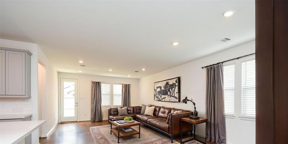 VIRTUALLY STAGED LIVING/DEN AREA