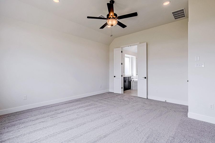 The primary suite provides a peaceful setting to unwind after a long day The primary suite provides a peaceful setting to unwind after a long day