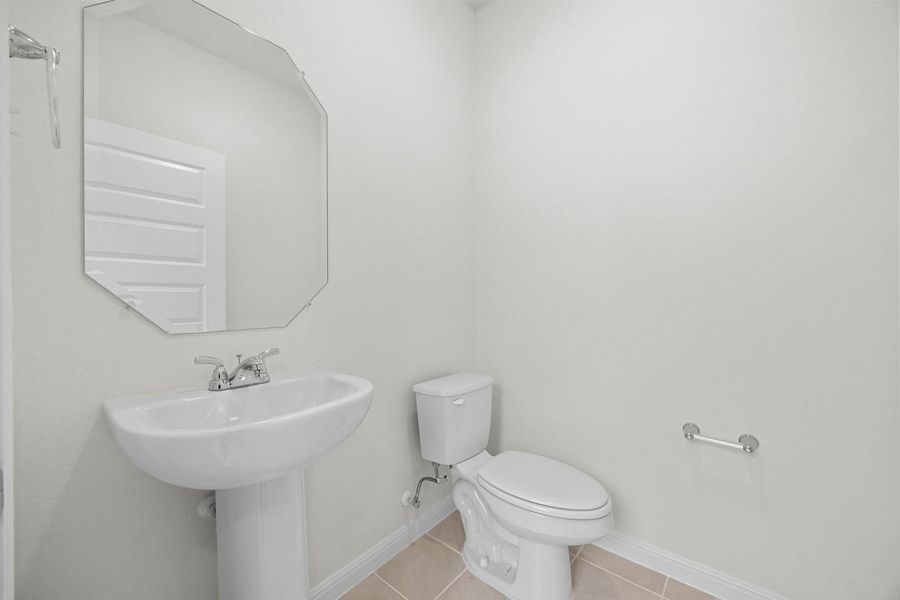 Half Bath in the Magnolia home plan by Trophy Signature Homes – REPRESENTATIVE PHOTO