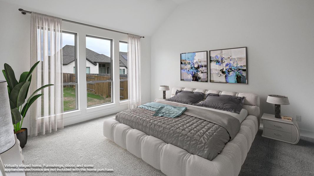 Carpeted bedroom with lofted ceiling