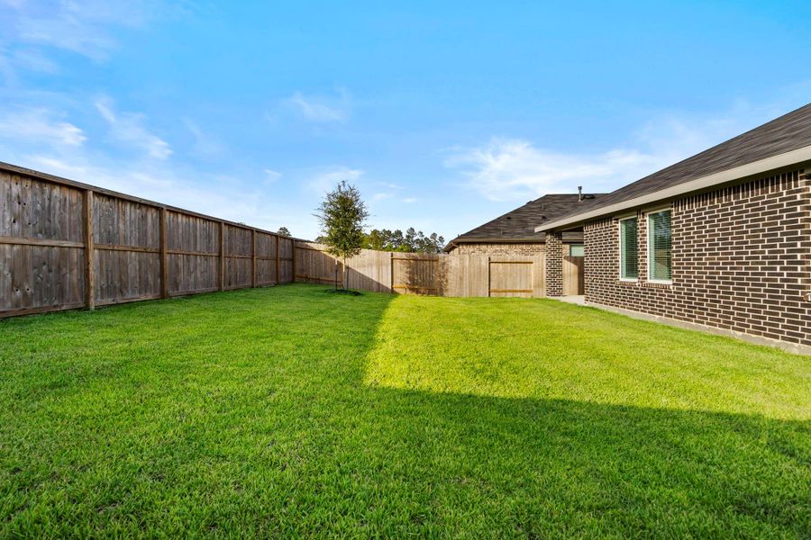 Exterior details and patio area of a home in Harrington Trails at The Canopies, Splendora (Image 4).