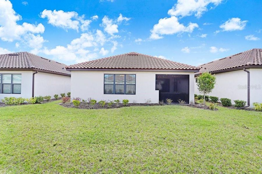 Exterior details and patio area of a home in Esplanade at Artisan Lakes, Palmetto (Image 3).