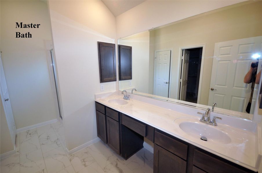 Dual Vanities in the Master Bath and Medicine cabinets are still standard at Cervelle Homes.