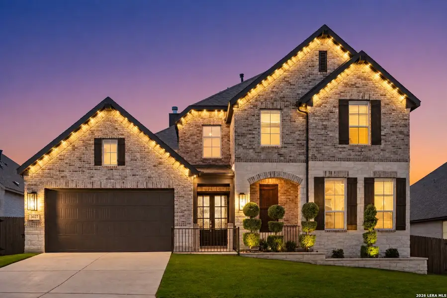 Front exterior of a new home in Ventana, Bulverde, TX, highlighting curb appeal (Image 2). Front exterior of a new home in Ventana, Bulverde, TX, highlighting curb appeal (Image 2).