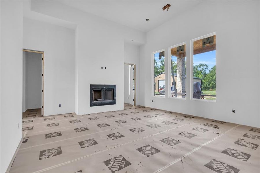 Unfurnished living room featuring a fireplace Unfurnished living room featuring a fireplace