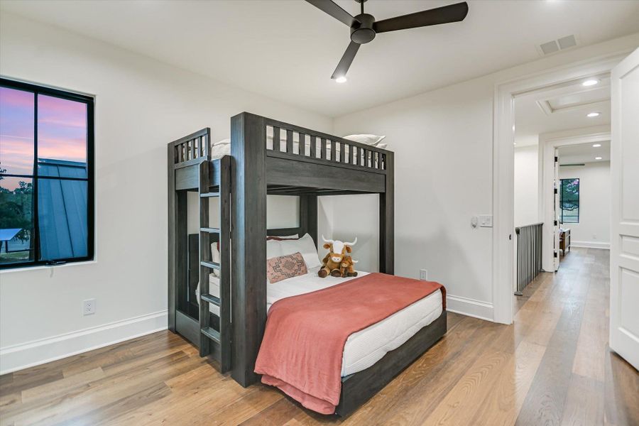 Bedroom featuring light wood-style flooring, ceiling fan, and recessed lighting Bedroom featuring light wood-style flooring, ceiling fan, and recessed lighting