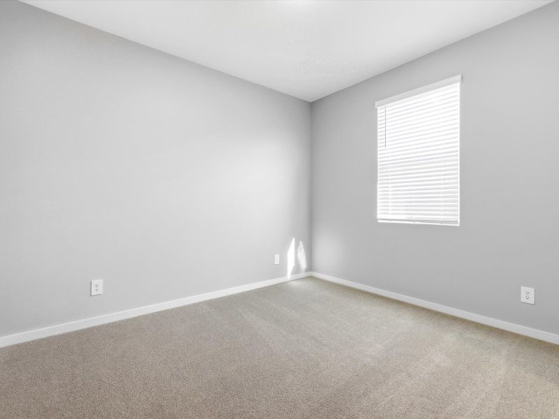 Spacious, unfurnished interior of a new home in White Tank Foothills Signature Series, Waddell (Image 14).