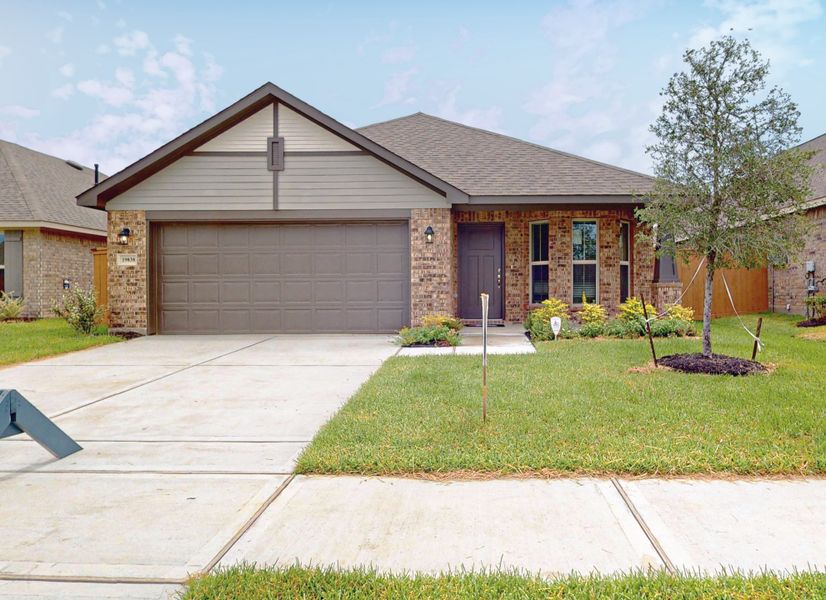 Front exterior of a new home in Cypress Green, Hockley, TX, highlighting curb appeal (Image 1). Front exterior of a new home in Cypress Green, Hockley, TX, highlighting curb appeal (Image 1).