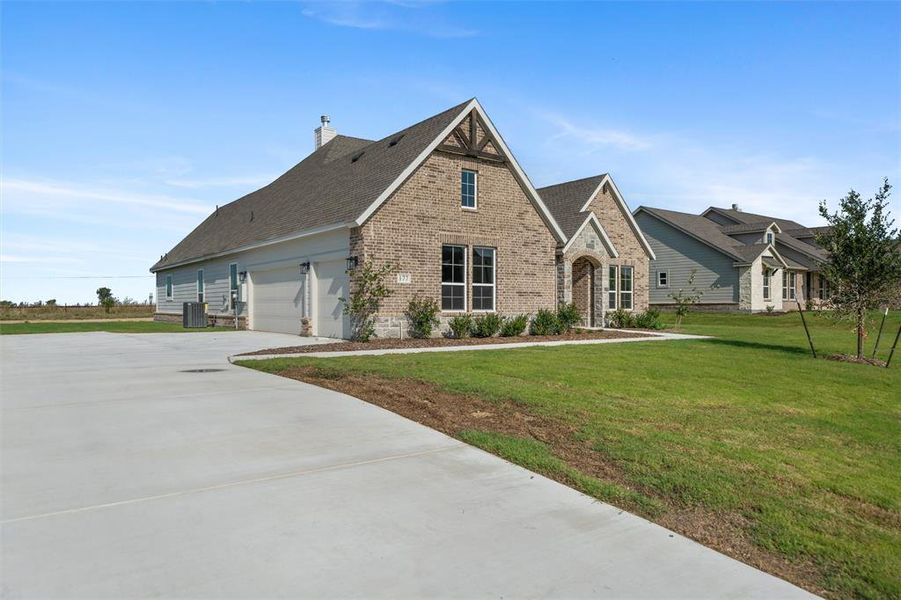 Front exterior of a new home in Fairview Meadows, New Fairview, TX, highlighting curb appeal (Image 23). Front exterior of a new home in Fairview Meadows, New Fairview, TX, highlighting curb appeal (Image 23).