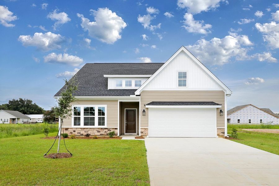 Front exterior of a new home in Garden Grove, Conway, SC, highlighting curb appeal (Image 1). Front exterior of a new home in Garden Grove, Conway, SC, highlighting curb appeal (Image 1).
