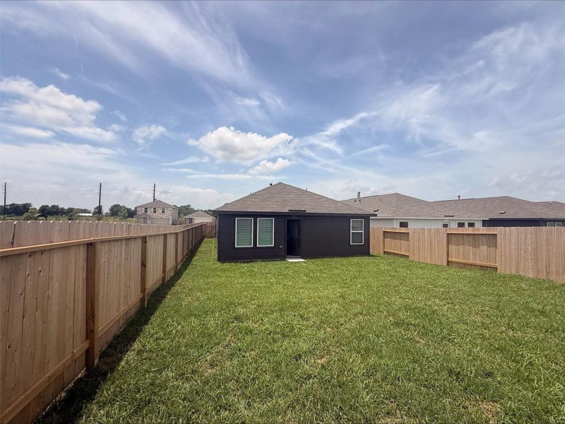 Exterior details and patio area of a home in Sweetgrass Village, Crosby (Image 3).